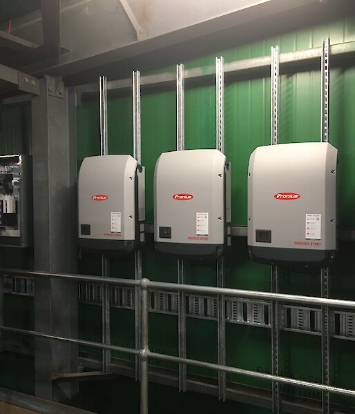 The three inverters that convert DC power into 240V AC power.