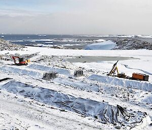 Biopiles covered by snow in winter.