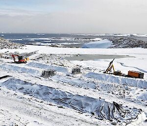 Biopiles covered by snow in winter.