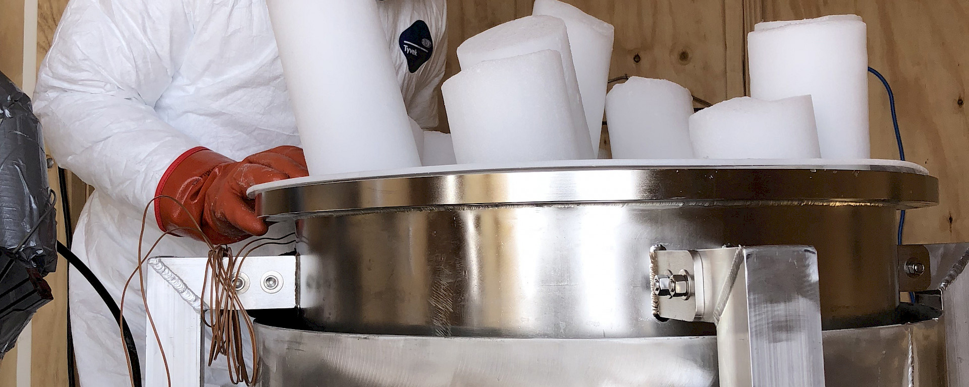 Co-Chief Investigator Vas Petrenko, from the University of Rochester, melting ice cores to extract the air trapped in bubbles. To prevent contamination of the samples, scientists had to wear ‘cleansuits’ and gloves.