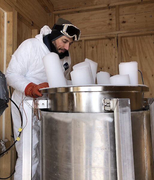 Co-Chief Investigator Vas Petrenko, from the University of Rochester, melting ice cores to extract the air trapped in bubbles. To prevent contamination of the samples, scientists had to wear ‘cleansuits’ and gloves.