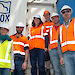 Six members of the AIRBOX team standing outside the shipping container.