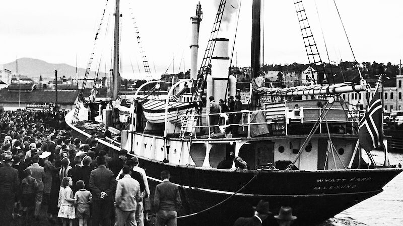 The Wyatt Earp docked in Hobart and surrounded by people.