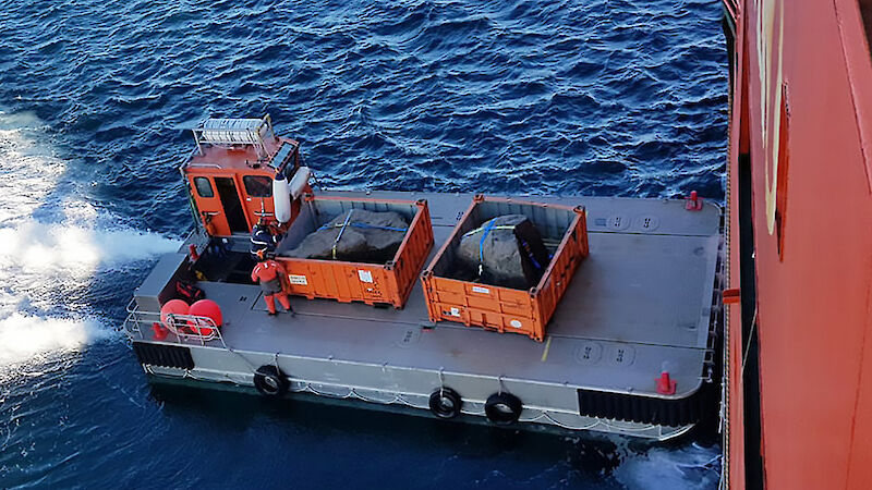 Two boulders of Mawson Charnockite being loaded on to the Aurora Australis, destined for the National Rock Garden in Canberra.