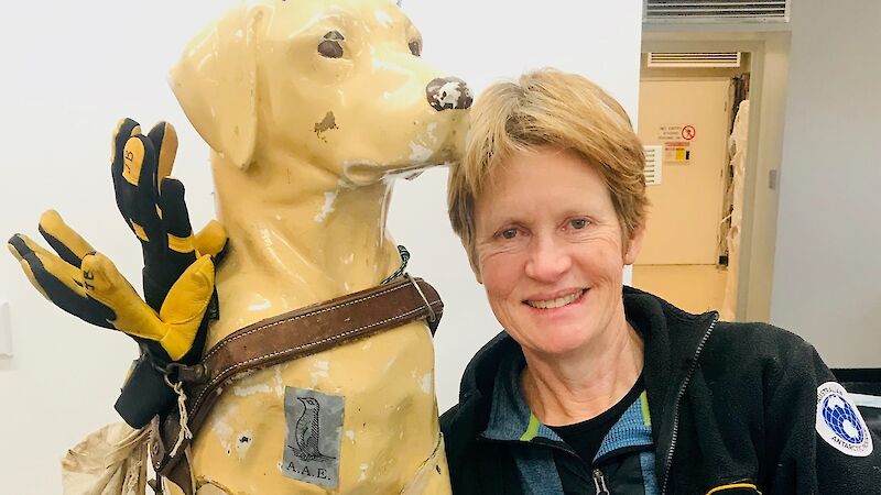Woman posing with aged fibreglass assistance dog