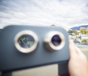 Binoculars installed at the Hobart waterfront. Looking through the lens, vision of an iceberg is revealed.