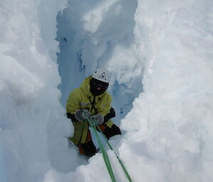 An expeditioner in a crevasse.