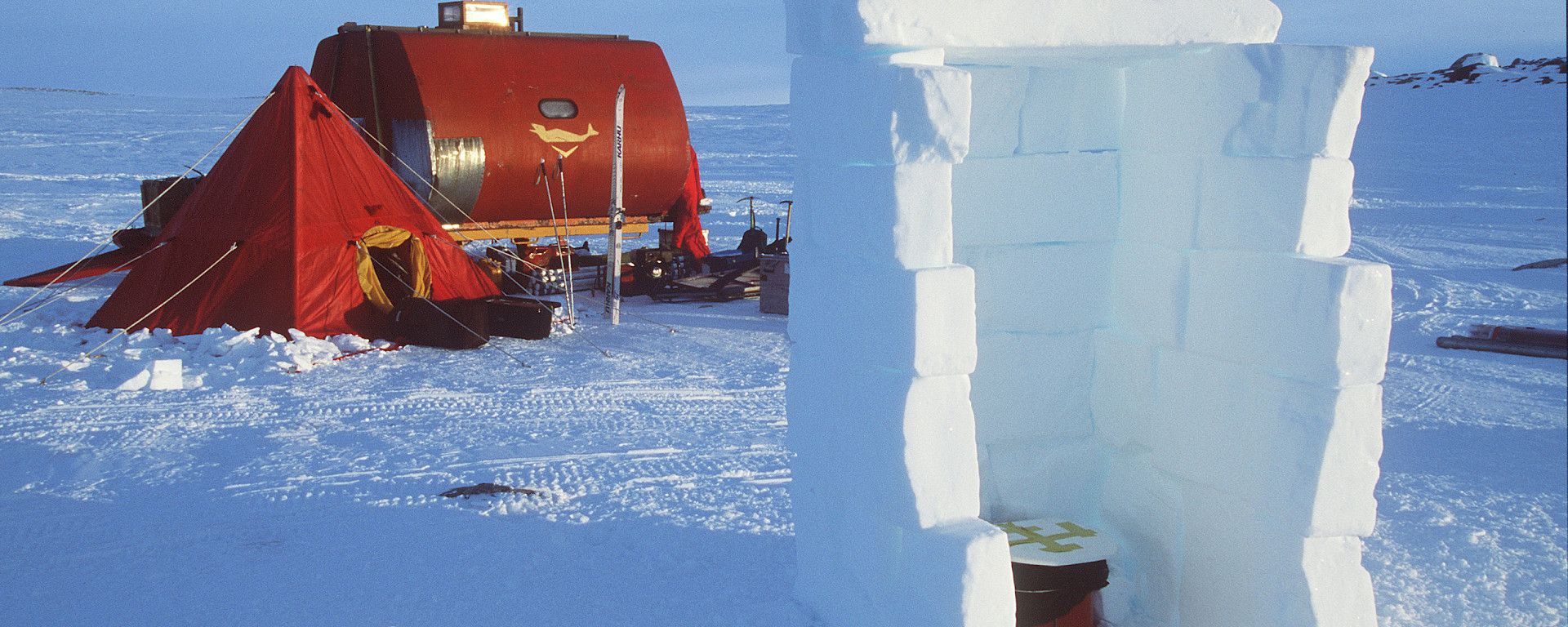 Field toilet in igloo. Tent and RMIT van in background