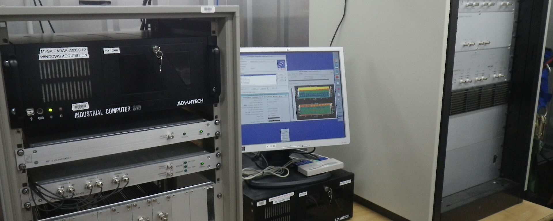 Industrial computers and screens on a bench