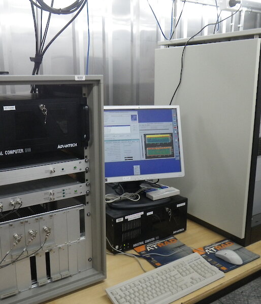 Industrial computers and screens on a bench