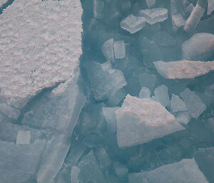 Accumulations of broken ice made up of fragments that are pieces refrozen and blue