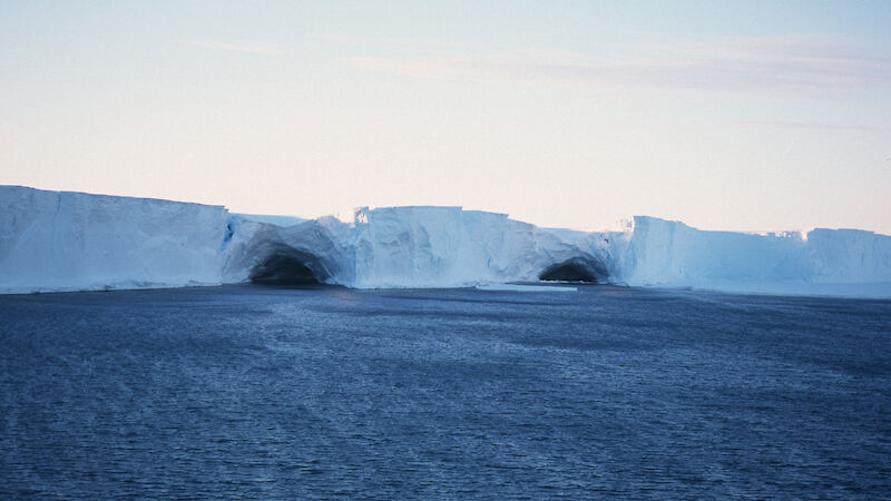 2 caves in a wall of ice.