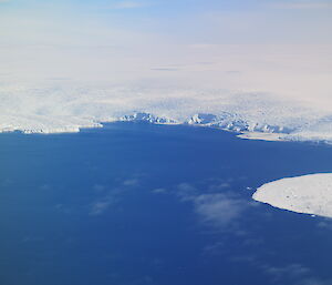 Blue water and white ice, viewed from the sky.