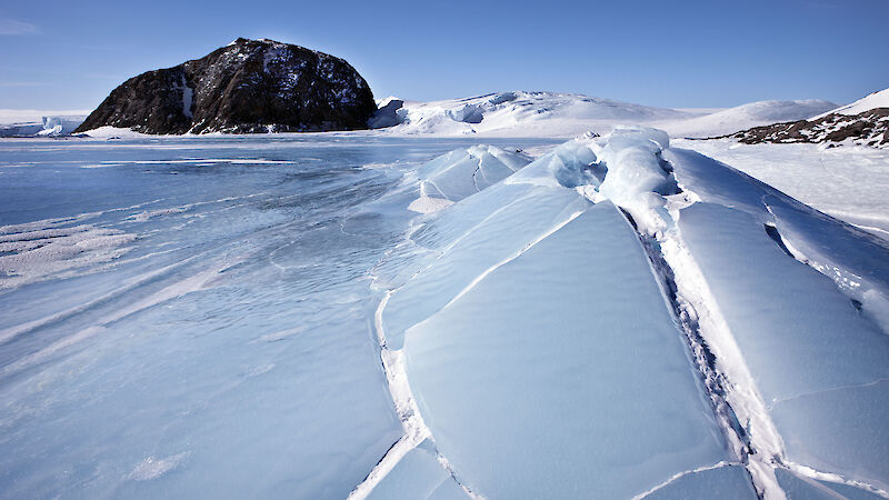 Ice rising into cracked lumps.