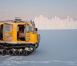 Oversnow vehicle parked on the ice