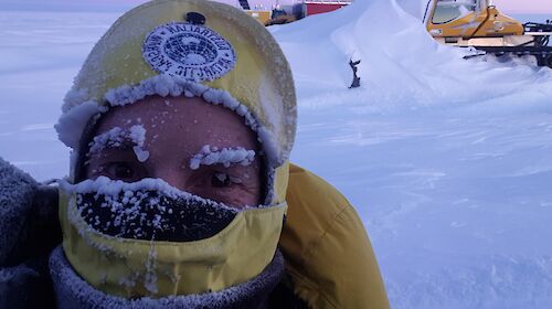 Expeditioner wearing cold weather gear with icicles on his eyebrows
