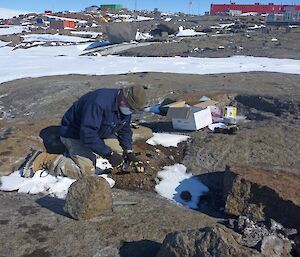 Mawson expeditioner collects a sample