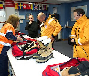 people visit the clothing store to obtain cold weather clothing