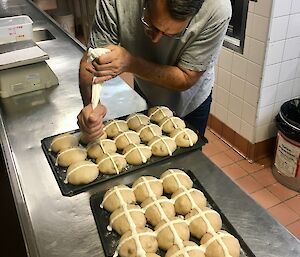 Chef preparing Easter buns in the kitchen