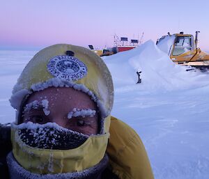 Expeditioner wearing cold weather gear with icicles on his eyebrows