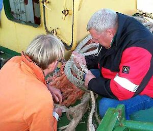 The Polar Bird captain inspects the broken tow cable.