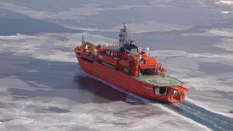 Aurora Australis ship travelling easily through light sea ice near Casey