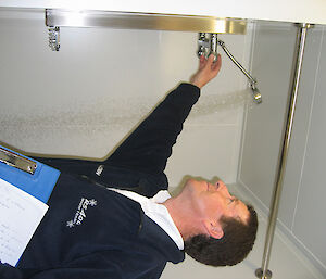 Engineer inspecting shower