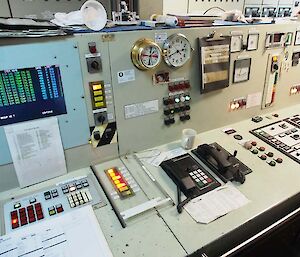 The desk with lots of switches and dials from which engines are controlled