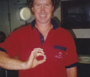 Man holding a large pearl