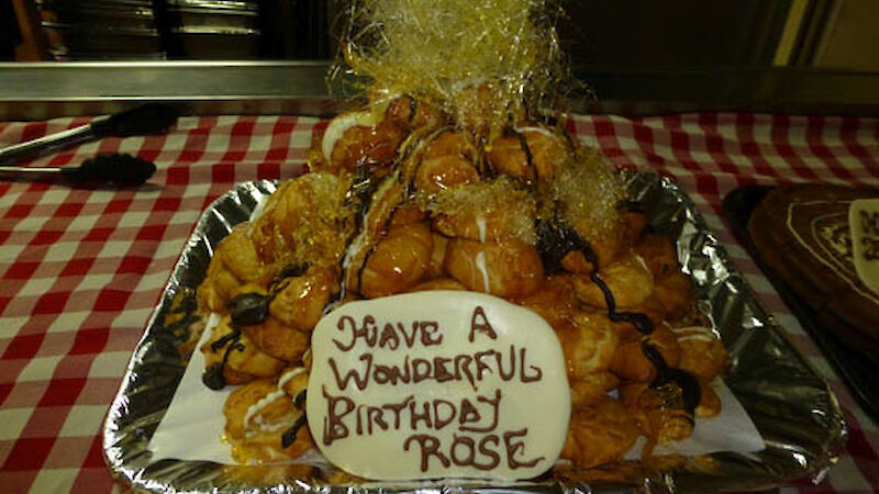 A small croquembouche topped with spun caramel.