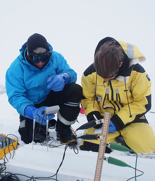 Ken and Christian measure the temperature along an ice core. (Photo Wendy Pyper)