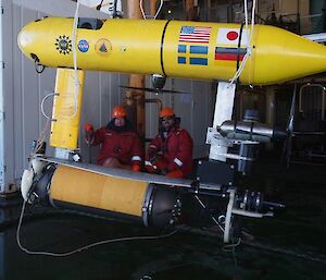 Crew members Doug Hawes (Integrated Rating) and Joe Macmenemy (Bosun) prepare to deploy the Autonomous Underwater Vehicle from the trawl deck of the ship (Photo: Wendy Pyper)