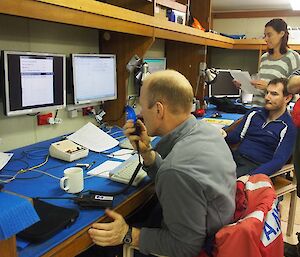 Science technical support manager Jono Reeve monitors deployment of the CTD, while data manager Miles Jordan looks on (Photo: Wendy Pyper)