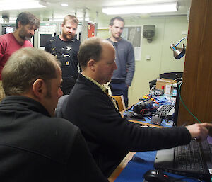 Electronics engineer Kym Newbery shows off the latest underwater footage from the ROV (Photo: Wendy Pyper)