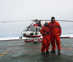 Dr Alison Kohout and Field Training Officer Christian Gallagher prepare to deploy the first accelerometer from a helicopter (Photo: Wendy Pyper)