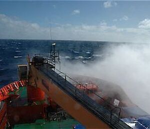 Wave crashing on the bow of the ship