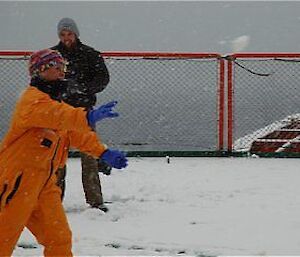 Expeditioners throwing snow