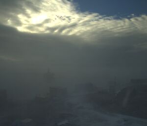 A tiny bit of blue sky shows through an almost totally obscured view from Mawson station