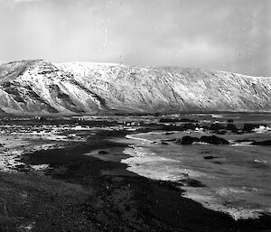 Black and white image of island coastline and bay