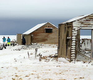 Borchgrevink’s hut of 1899 on the left, the remains of Victor Campbell’s hut from 1911 on the right.