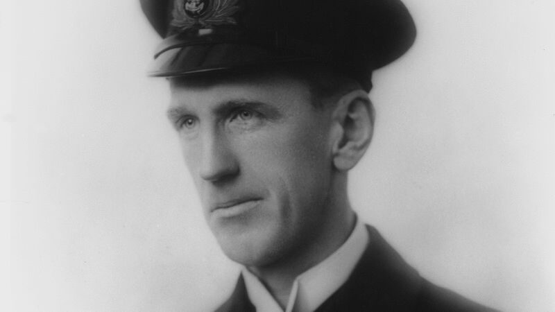 Black and white formal portrait of master mariner in uniform wearing polar medal