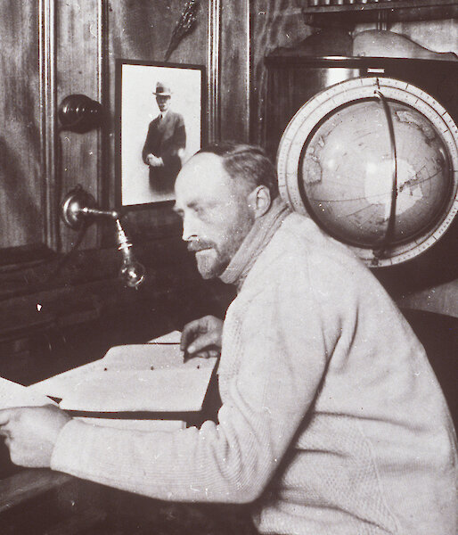 Sir Douglas Mawson in the Commander’s Cabin on the Discovery, 1929.