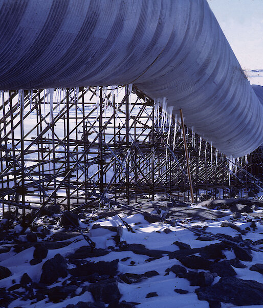 Looking along the curved wall of the Casey tunnel building, looks like a large, long metal pipe
