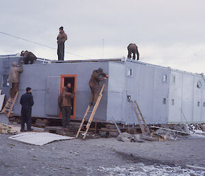 Cold porch being fitted to the sleeping quarters in 1964.