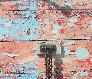 Weathered surface showing old dog chain, Biscoe Hut, 1997