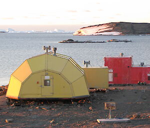 Yellow building in the shape of half a pineapple