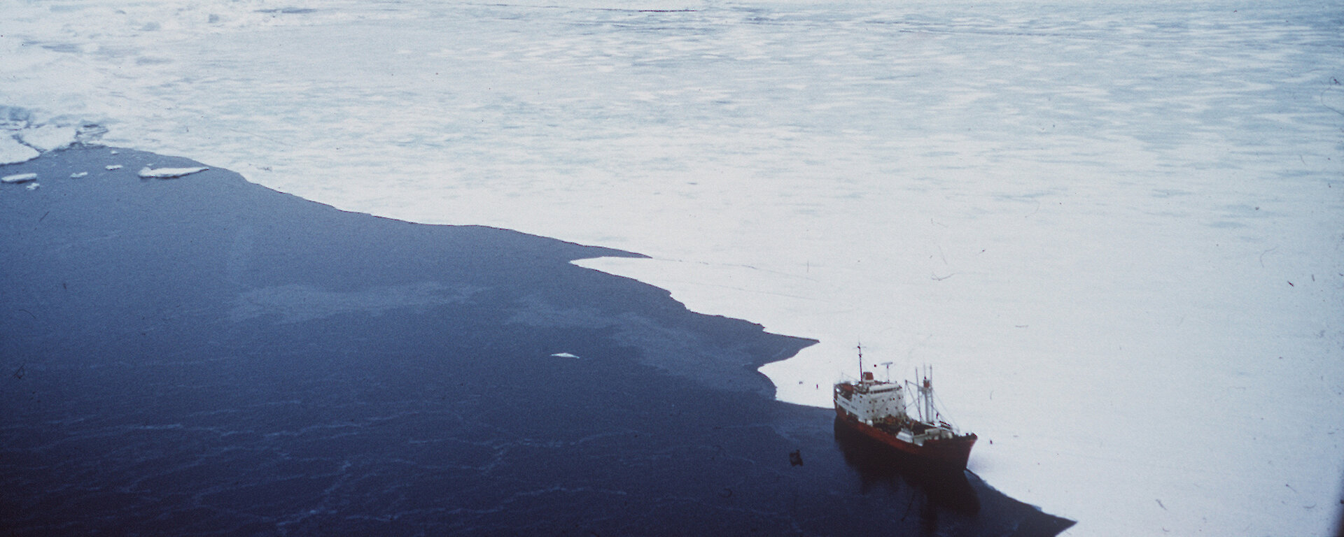Magga Dan moored against fast ice off Magga Peak, Oates land 1959