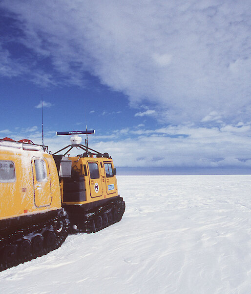 Hägglunds driving across the ice, away from the camera