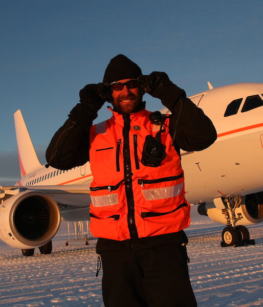 Expeditioner in front of aircraft