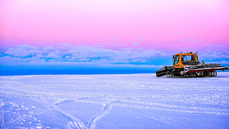 Casey ski landing area at dusk with a large tracked vehicle to the right